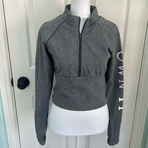 DOT brand cropped top with "Own it" on the sleeve